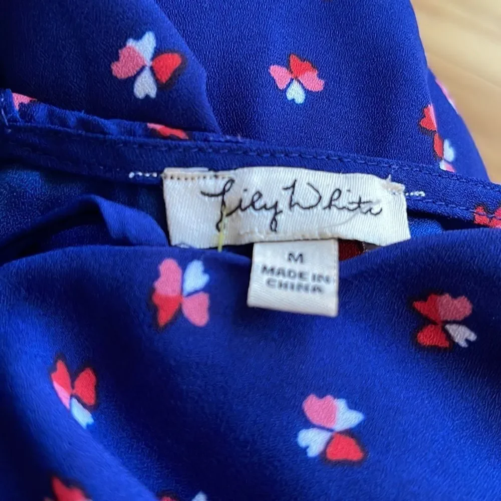 Lily White navy tiny heart flowers pattern X neckline top. Medium.